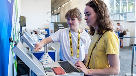 volunteer helping at kiosk